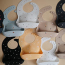 mushie Silicone Baby Bib | Adjustable Fit Waterproof Bibs (Letters White) by TinyTreasures Baby Boutique