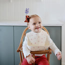mushie Silicone Baby Bib | Adjustable Fit Waterproof Bibs (Bows) by TinyTreasures Baby Boutique