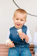 Loulou Lollipop Soft, Waterproof Silicone Feeding Bib by TinyTreasures Baby Boutique
