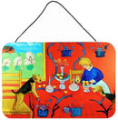 Airedale Terrier with lady in the kitchen Wall or Door Hanging Prints