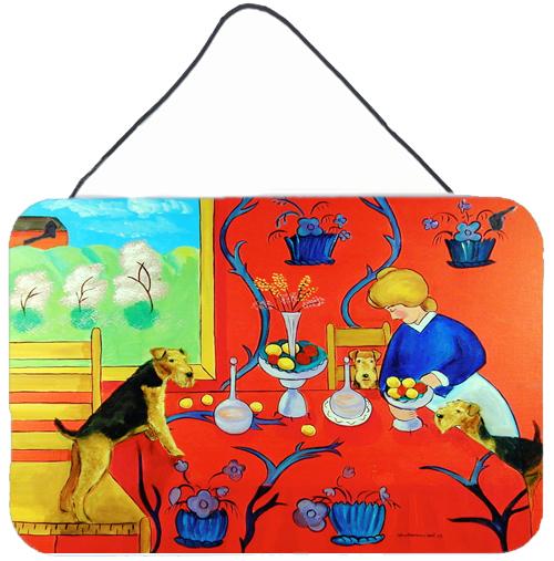 Airedale Terrier with lady in the kitchen Wall or Door Hanging Prints