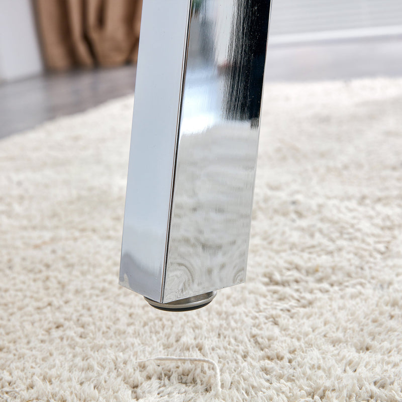 A modern minimalist rectangular glass dining table with tempered glass tabletop and silver metal legs, suitable for kitchens, restaurants, and living rooms,63"x35.4"x30"