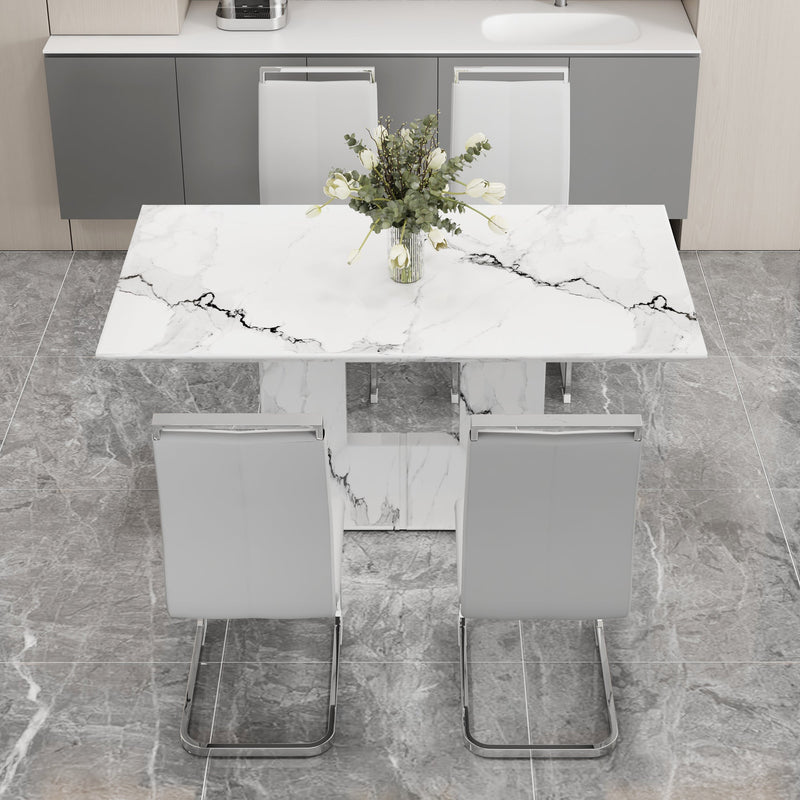 A simple dining table. A dining table with a white marble pattern. 4 PU synthetic leather high backrest cushioned side chairs with C-shaped silver metal legs. DT-SQ-16090-wh
