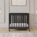 Foundations Boutique Folding Mini Baby Crib - Compact, Portable, Wooden Hotel Crib, Foldable Compact Cribs for Baby & Toddlers - Includes 3" Foam Mattress - Ebony by TinyTreasures Baby Boutique