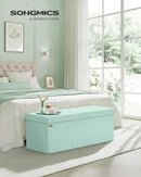 SONGMICS MAZIE Collection - Storage Ottoman Bench, Foldable Foot Rest, 15 x 43 x 15 Inches, End of Bed Bench, Storage Chest, Load 660 lb, Living Room, Bedroom, Entryway, Moonlight Green ULSF604C01 by CozyNest Decor