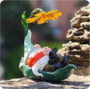 Solar Powered Gnome Garden Statue - Resin Gnome on Green Leaf with Large Yellow Stamen Sunshade, LED Lights Decorations, for Women Men, Outdoor Decor Ornaments for Outside by GreenHaven Gardens