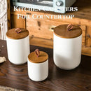 JOJUNO White Ceramic Canister Set with Wooden Lid, 3-Piece Airtight Food Storage Jars for Kitchen Counter - Flour, Sugar, Coffee, Tea, Spice - Small, Medium, Large Sizes by CozyNest Decor