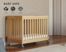 Foundations Boutique Folding Mini Baby Crib - Compact, Portable, Wooden Hotel Crib, Foldable Mini Cribs for Baby & Toddlers - Includes 3" Foam Mattress - Natural by TinyTreasures Baby Boutique