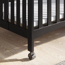 Child Craft London Mini Compact Folding Portable Crib with 2” Crib Mattress and 2 Easy Roll Locking Wheels, Durable Pine Wood Construction (Ebony Black) by TinyTreasures Baby Boutique