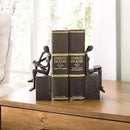 Danya B. Metal Art Shelf Decor - Decorative Cast Iron Bookend Set - Man and Woman Reading on a Block by CozyNest Decor