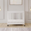 Foundations Boutique Folding Hotel Crib and Sheet Bundle - Includes Wooden Mini Crib with 3" Foam Mattress (White) and 6-Pack White Fitted Compact Sheets by TinyTreasures Baby Boutique