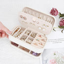DesignSter Small Travel Jewelry Box with Double Zipper, 2 Layers PU Portable Jewelry Case for Women and Girls,Travel Jewelry Organizer for Rings, Earrings, Necklaces, Bracelets,Beige by TinyTreasures Baby Boutique