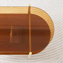 Oval Glass Coffee Table, Mid-Century Modern Design, L41 x W21 x H17 inch, for Living Room, 2-Tier Structure, Amber Glass Top and Walnut Finish Wood Shelf, Conical Legs with Gold Finish Frame