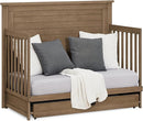 Delta Children Simmons Kids Caden 6-in-1 Convertible Crib with Trundle Drawer, Greenguard Gold Certified, Aged Oak by TinyTreasures Baby Boutique
