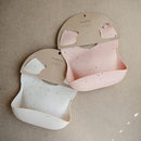 mushie Silicone Baby Bib | Adjustable Fit Waterproof Bibs (Powder Pink Confetti) by TinyTreasures Baby Boutique