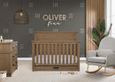 Delta Children Simmons Kids Caden 6-in-1 Convertible Crib with Trundle Drawer, Greenguard Gold Certified, Aged Oak by TinyTreasures Baby Boutique