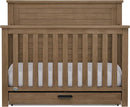 Delta Children Simmons Kids Caden 6-in-1 Convertible Crib with Trundle Drawer, Greenguard Gold Certified, Aged Oak by TinyTreasures Baby Boutique
