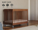 Foundations Boutique Folding Mini Baby Crib - Compact, Portable, Wooden Hotel Crib, Foldable Compact Cribs for Baby & Toddlers - Includes 3" Foam Mattress - Cherry by TinyTreasures Baby Boutique