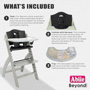 Abiie Beyond Junior Wooden High Chair with Tray - Adjustable and Convertible High Chair for Babies and Toddlers - 6 Months to 250 Lb - Water Resistant - Misty Grey Wood with Black Pearl Cushion by TinyTreasures Baby Boutique