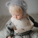 mushie Silicone Baby Bib | Adjustable Fit Waterproof Bibs (Lilac Flowers) by TinyTreasures Baby Boutique