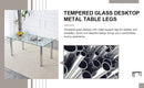 A modern minimalist style glass dining table. Transparent tempered glass tabletop with a thickness of 0.3 feet and silver metal legs. Suitable for restaurants and living rooms. 63 "x 35.4" x 30"