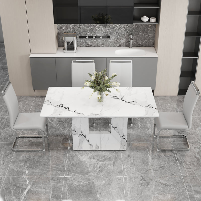 A simple dining table. A dining table with a white marble pattern. 4 PU synthetic leather high backrest cushioned side chairs with C-shaped silver metal legs. DT-SQ-16090-wh