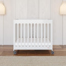 Foundations Boutique Folding Mini Baby Crib - Compact, Portable, Wooden Hotel Crib, Foldable Compact Cribs for Baby & Toddlers - Includes 3" Foam Mattress - White by TinyTreasures Baby Boutique