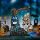 Halloween Skull Statue with Spooky LED Light for Holiday Decorations, Halloween Decor with Romantic Skeleton Couple on Swing Tombstone Tree, Grinning Skull Decor Props Haunted Collectible Gift by CozyNest Decor