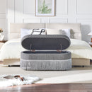 Oval Upholstered Storage Ottoman with Fringe Trim