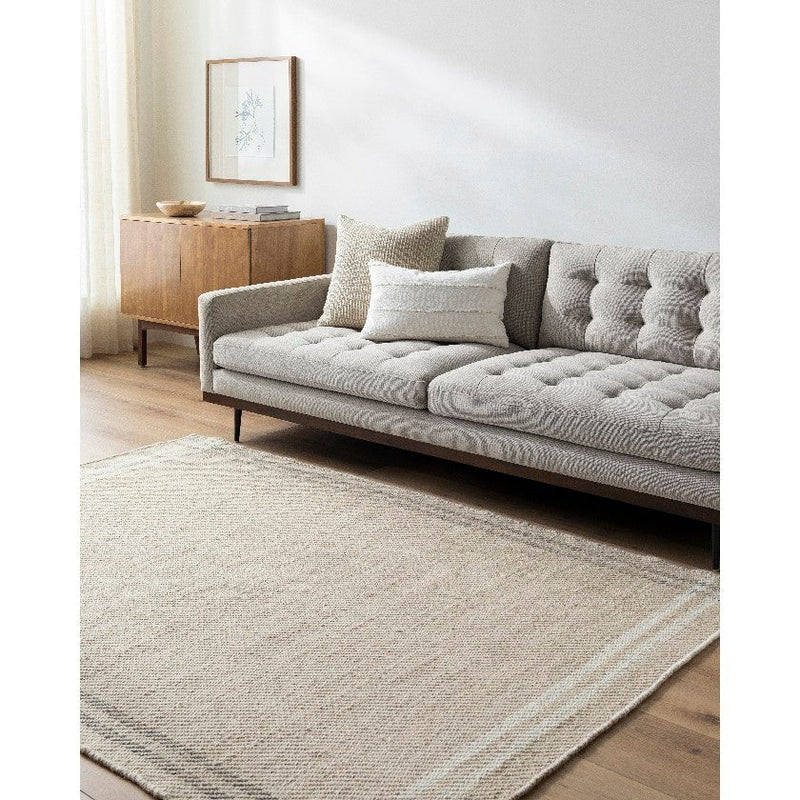 Janmichael Solid and Border Light Beige Area Rug