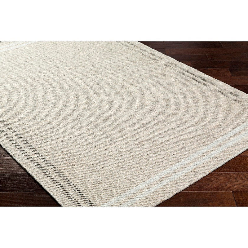 Janmichael Solid and Border Light Beige Area Rug