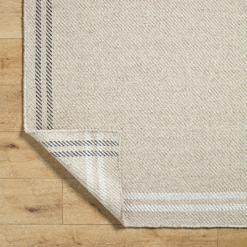 Janmichael Solid and Border Light Beige Area Rug