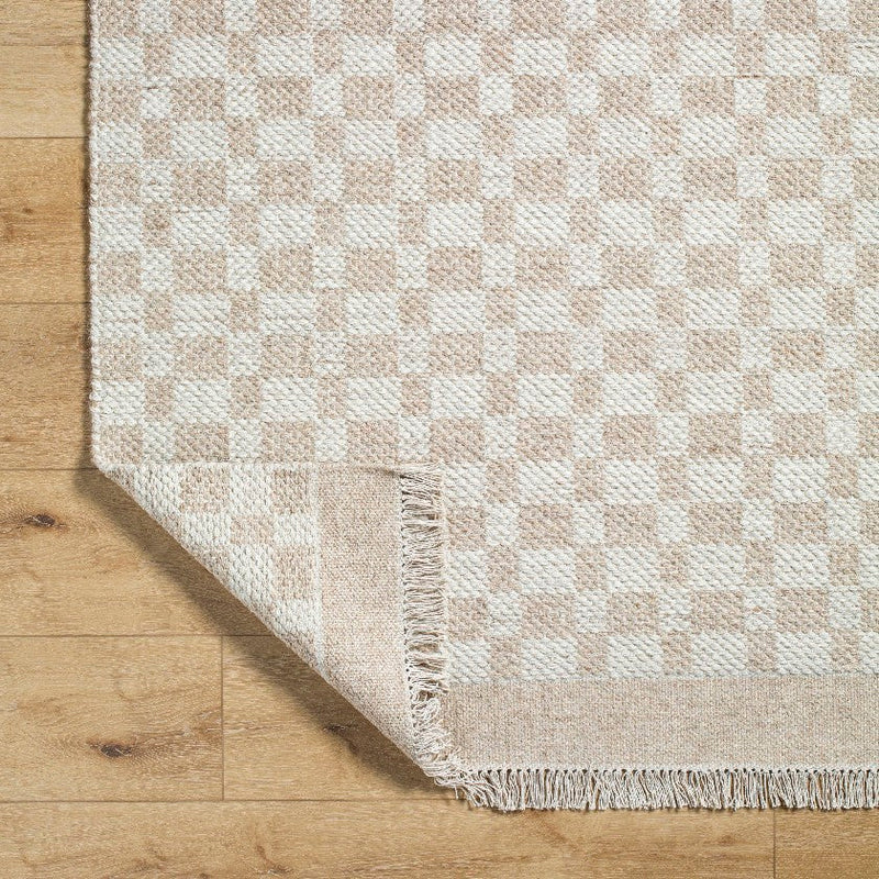 Clinten Solid and Border Tan Area Rug