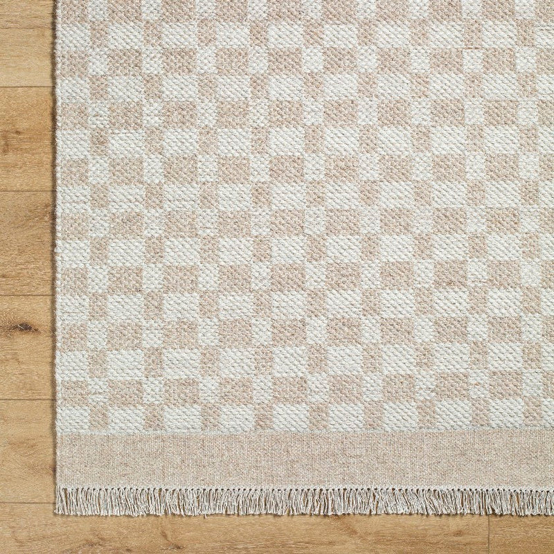 Clinten Solid and Border Tan Area Rug