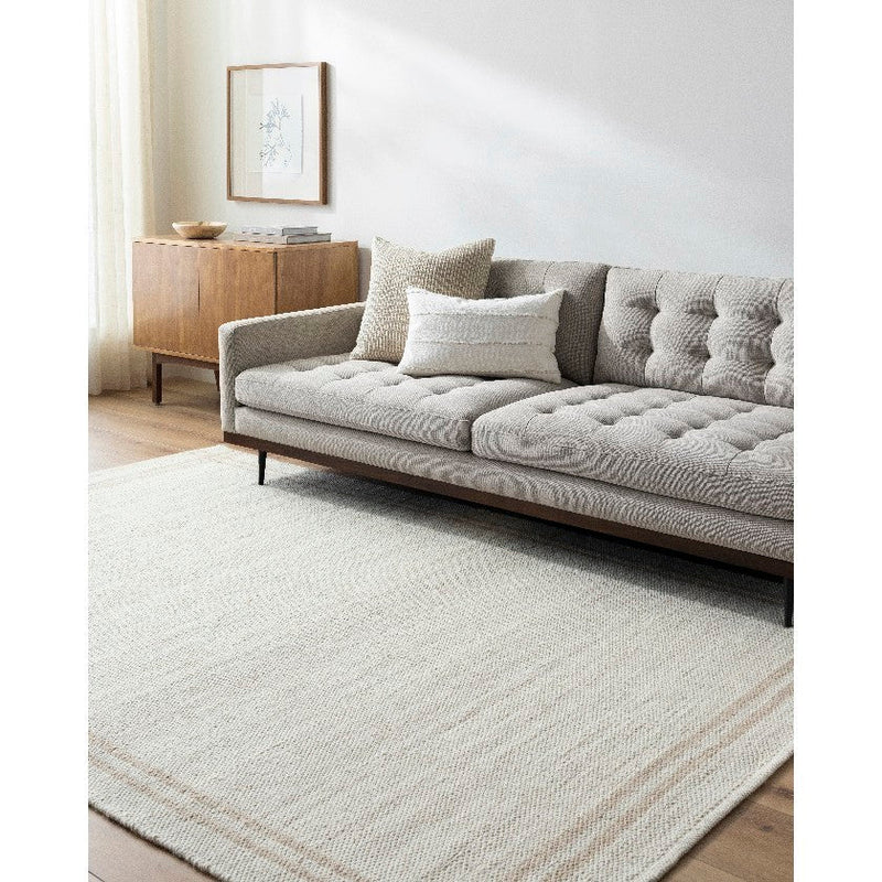 Janmichael Solid and Border Ivory Area Rug