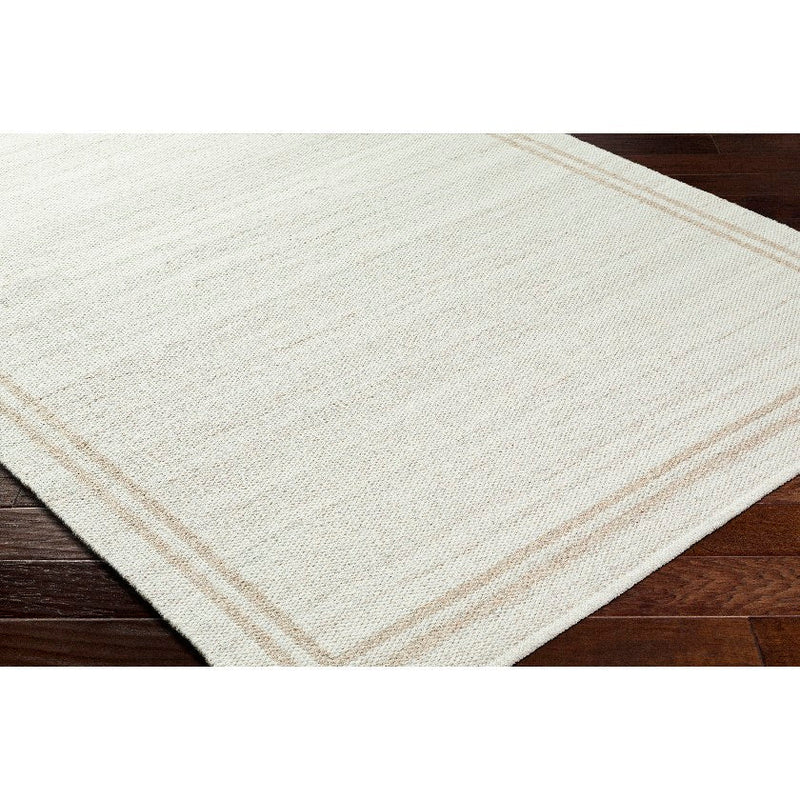 Janmichael Solid and Border Ivory Area Rug