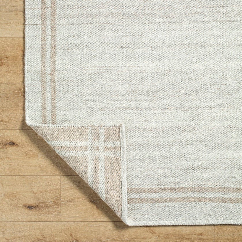 Janmichael Solid and Border Ivory Area Rug