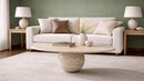 Cacia Oval Travertine Coffee Table with Single Sphere Base