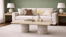 Alessa natural travertine coffee table with double cylinder pedestal base and rounded edge top