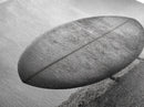 Surfboard Alone, Beach Sand, Cloudy Sky, Framed Canvas Print, minimalist surf art, coastal man cave decor, surf lover gift idea