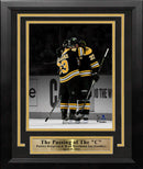 Brad Marchand & Patrice Bergeron Hug During Bergeron's Final Game Boston Bruins 8x10 Framed Photo by Dynasty Sports & Framing