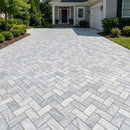 Driveway with herringbone patterned bricks in front of a house Bluestone tumbled pavers 6"x12"