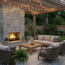 Outdoor patio with stone fireplace, pergola, and patio furniture. Bluestone Marble 3D Ledger Stone Panel 6"x24"