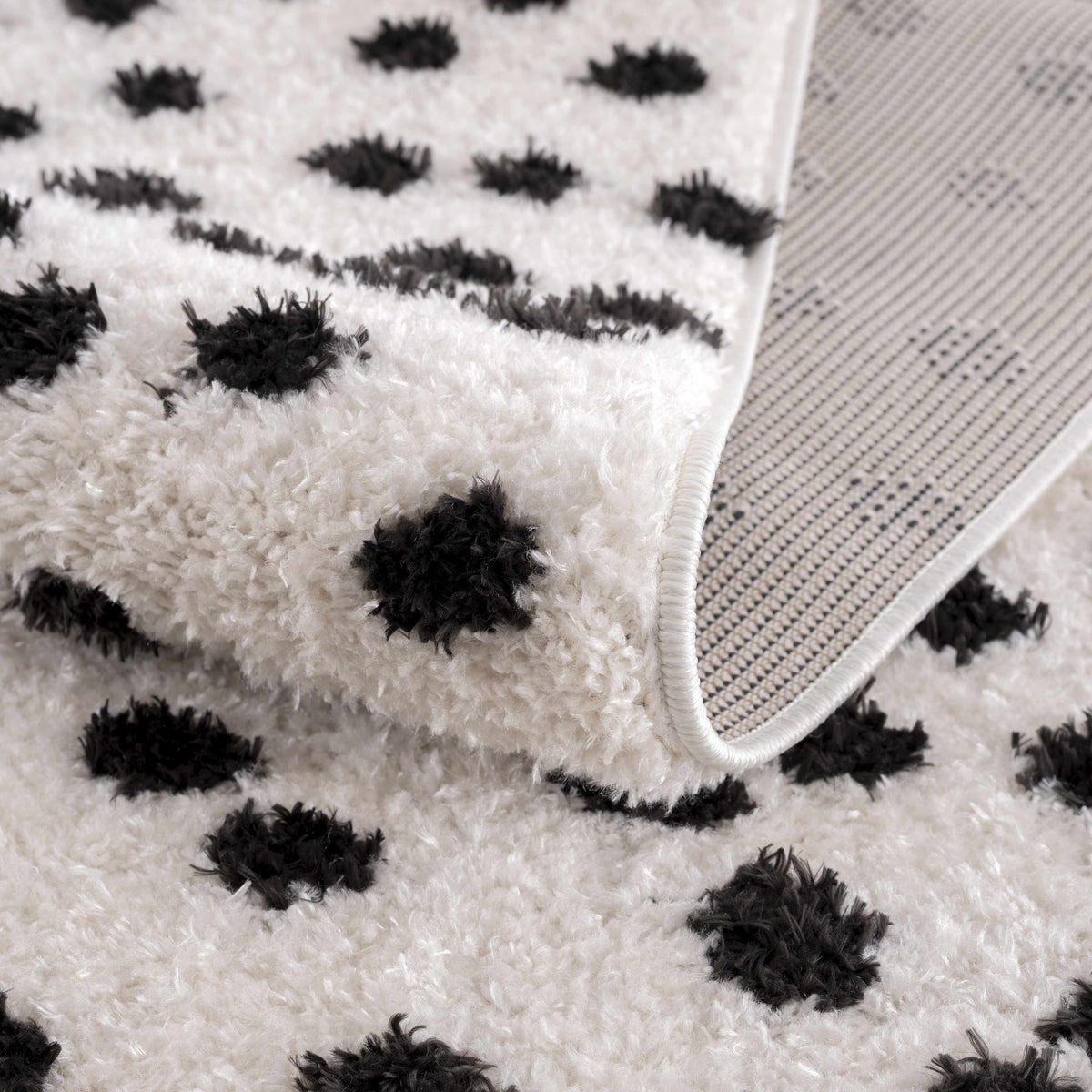 Cansu Black & White Dotted Area Rug, photo 8 of 19