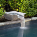 Modern water feature with a rectangular basin and waterfall into a pool, surrounded by greenery. Carrara White Marble Natural Stone Pool Square Poolwok with Lip