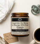 Congrats On Being In Charge Of A Tiny Human 9oz Family Candle Malicious Women Co by Malicious Women Co.