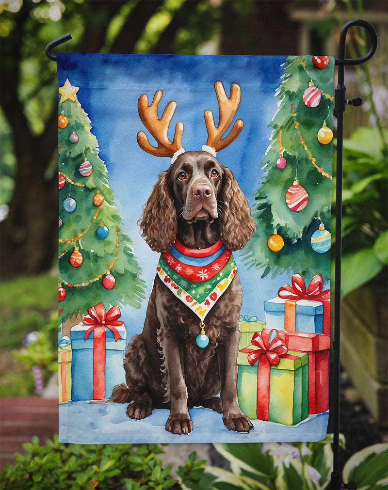American Water Spaniel Christmas Garden Flag – Dog in Reindeer Antlers with Tree & Gifts