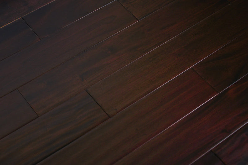 "Indo Mahogany Distressed/Handscraped Solid Hardwood Flooring in a Dark Ebony finish, 3/4 x 5 inches. SKU: TRPSH-IMDE. Revel in the luxurious depth and character of this exquisite flooring choice, adding elegance to any space."