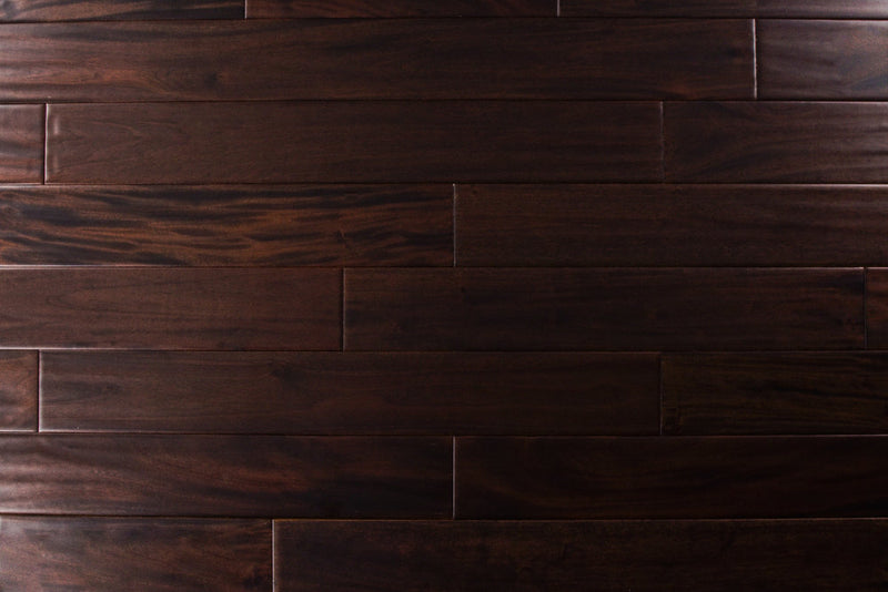 "Indo Mahogany Distressed/Handscraped Solid Hardwood Flooring in a Dark Ebony finish, 3/4 x 5 inches. SKU: TRPSH-IMDE. Revel in the luxurious depth and character of this exquisite flooring choice, adding elegance to any space."