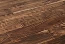 "Capture the essence of natural beauty with Exotic Walnut Natural Solid Hardwood Flooring, available in 3.6" and 4.75" widths and 0.75" thickness. Choose between Smooth or Handscraped finishes. SKU: TRPSH-EWNH, TRPSH-EWNS4.75, TRPSH-EWNS3.6."